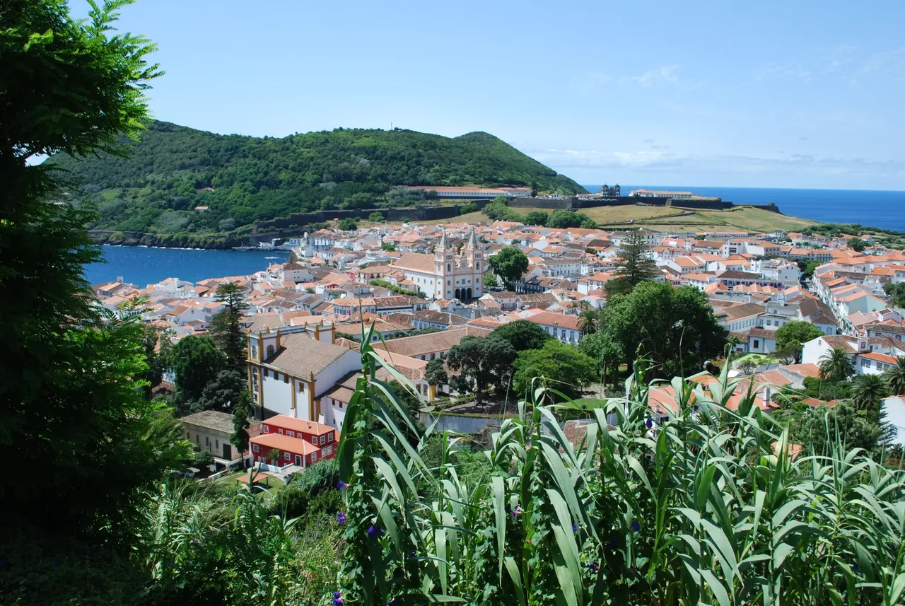 Rooftops of Angra do Heroísmo with the cathedral towers and Monte Brasil behind, seen from the Alto da Memória