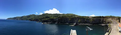 Steep cliffs and islets along the Flores coast near Ponta Delgada.