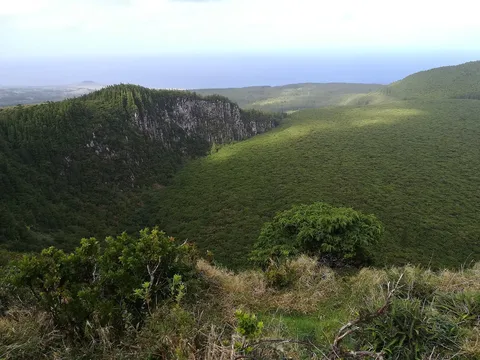 The deep green crater of Rocha do Chambre on Terceira.